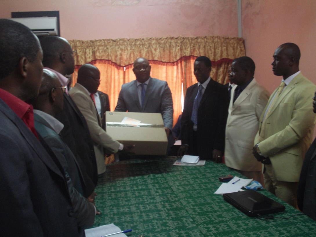 © 2014 AU-IBAR. The representative of the Director AU-IBAR, Dr Ibrahim Gashash Ahmed, handing over computers donated by AU-IBAR to the CVO Gabon, Dr Daniel OBAME ONDO during the opening ceremony of the National ARIS training.